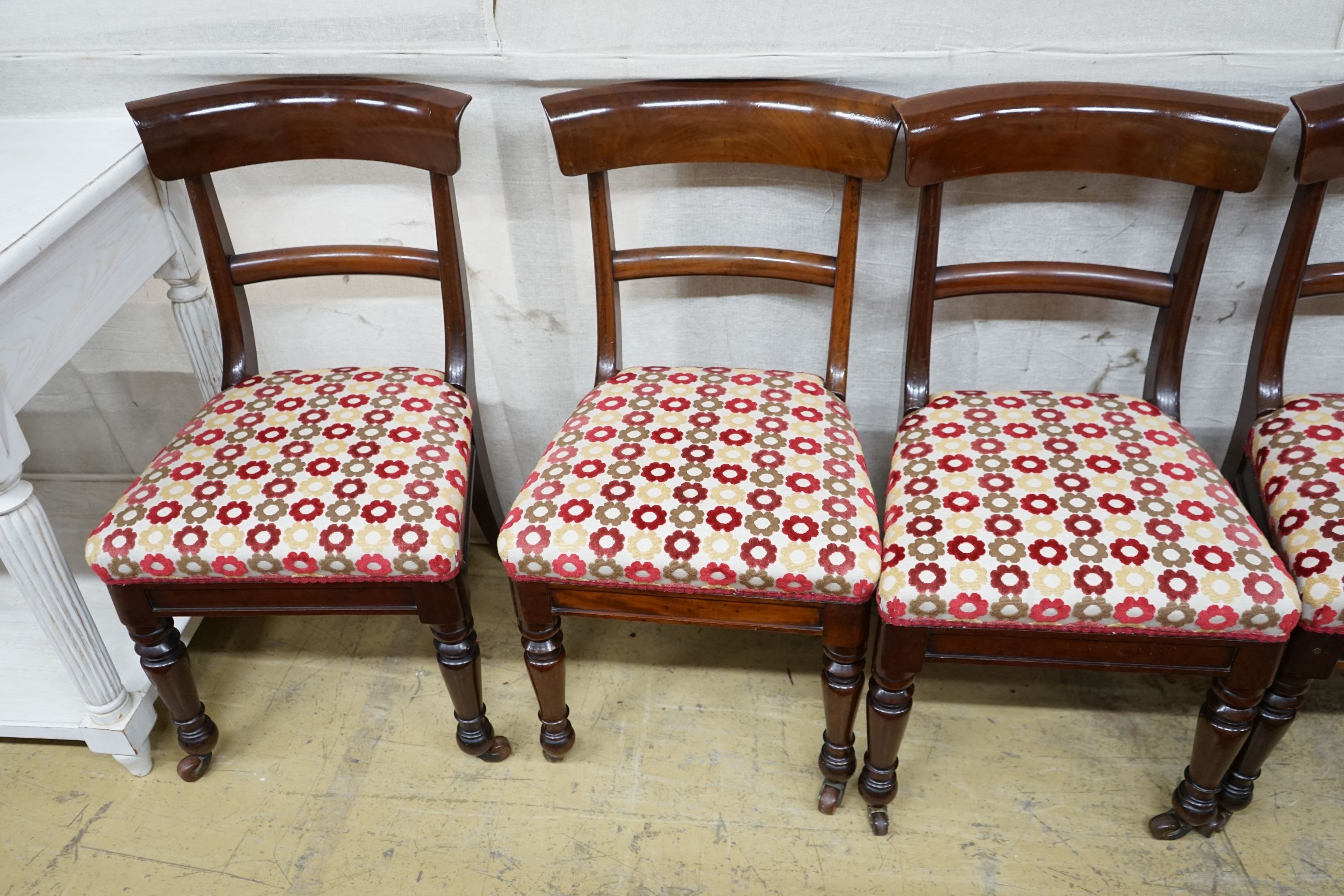 A set of eight mid Victorian mahogany dining chairs